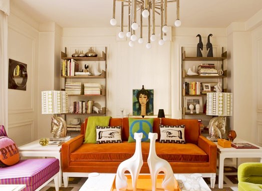 Jonathan Adler's NYC home with Jonathan Adler designed Meurice Chandelier, burnt orange sofa and pink armchair