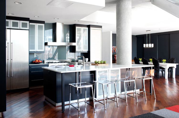 Modern kitchen with black cabinets, drawers and island