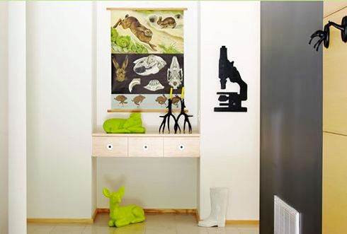  Foyer of a modern Hudson Valley home with chartreuse deer sculptures and a white Harry Allen boot umbrella stand