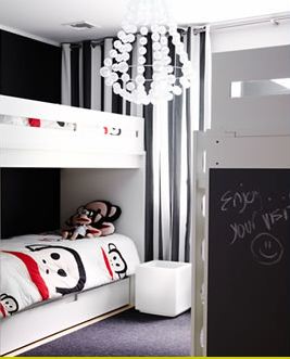 Kids room in a modern home with white bunk beds and a white chandelier