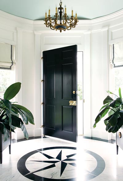 foyer with high gloss black front door, marble inlay floor, Greek key trim roman shades and a Benjamin Moore Palladium Blue ceiling