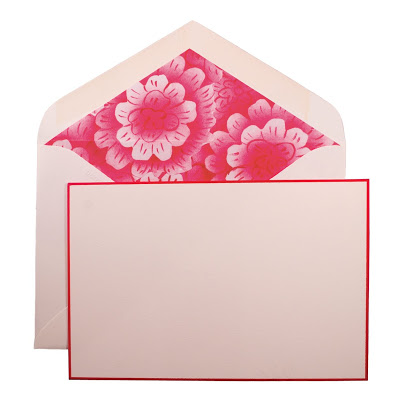 Stationary by John Derian with red trimmed envelop and red flowers on the inner top flap