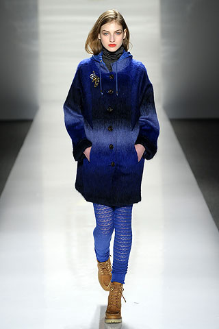 Model from Tory Burch's Fall Ready-to-Wear 2010 show wearing royal blue pants and jacket