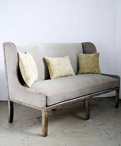 Sofa with a flat iron base upholstered in grey fabric