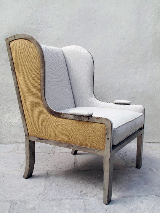 wingback chair with iron base and upholstered seat and bac