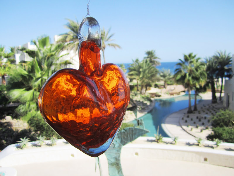 Close up of one of the glass hearts and a view of the resort in Mexico