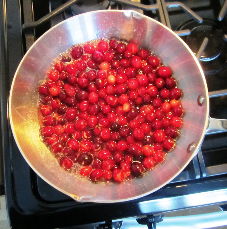 cranberries being cooked to make cranberry sauce
