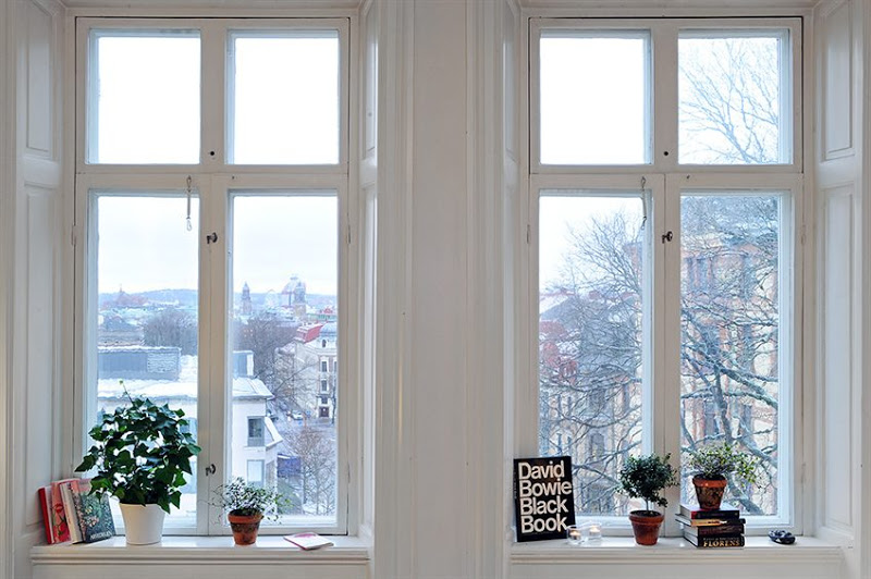 White windows with a view in a Swedish apartment