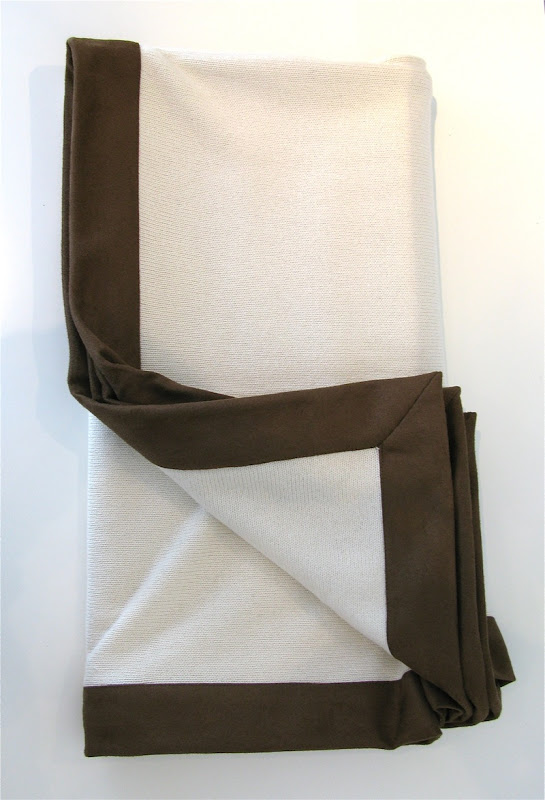 Ivory colored cashmere, silk, cotton blend throw with chocolate brown suede border from Pieces Inc.