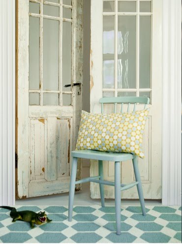 Brita Sweden rug in a foyer with a rustic door and powder blue wooden chair