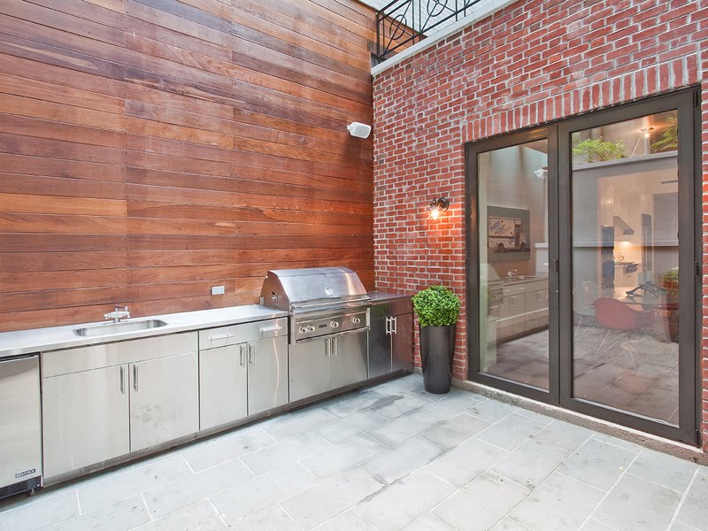 Outdoor patio in a LEED certified townhouse with stainless appliances, drawers and cabinets.