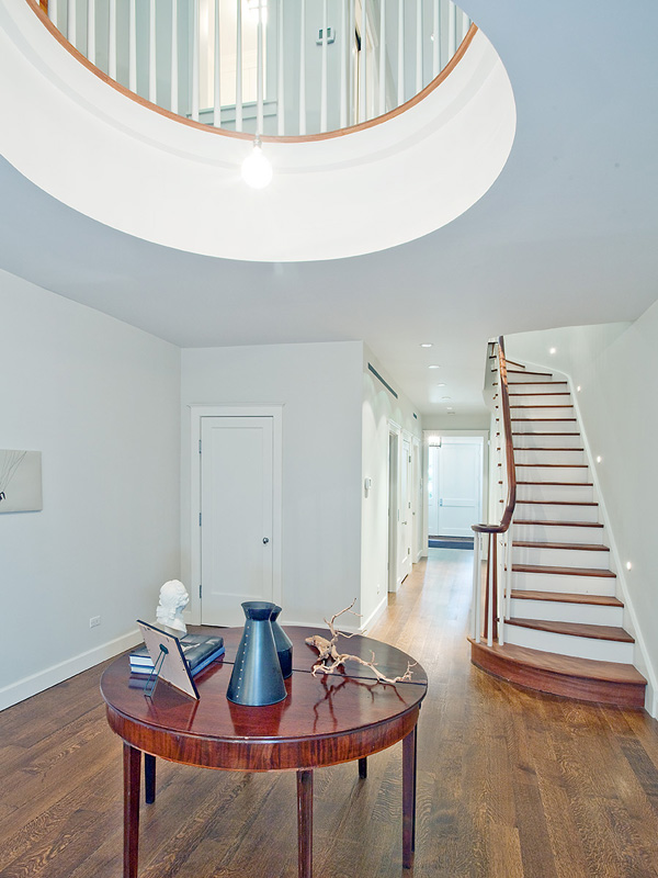 foyer with round loft opening to the second floor balcony/landing in a LEED certified townhouse