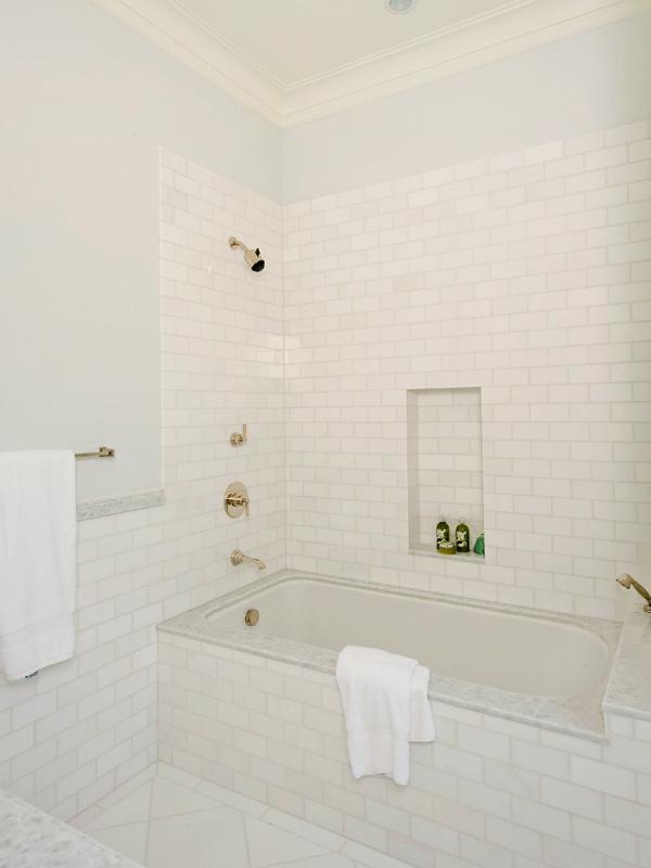 Bathroom with natural subway tile tub and shower