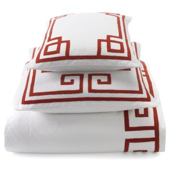 Bright white bedding with red trim from Williams Sonoma Home