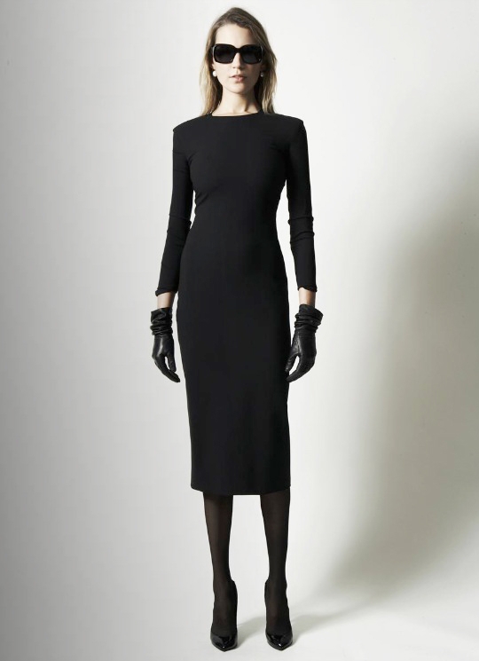 Model wearing a black dress from The Row