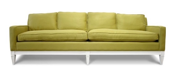 Green sofa with white exposed legs from Jonathan Adler