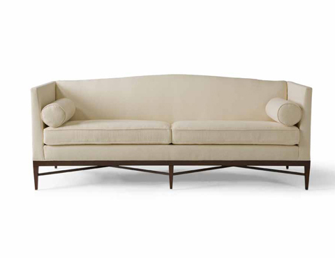 Cream sofa from Bolier & Company with high arms, slightly curved back and exposed wood legs