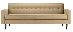Tan tufted sofa with solid wood legs from Design within Reach