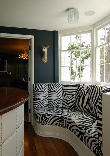 Zebra print built in banquette seating in a in a restored Regency home by Kevin Oreck