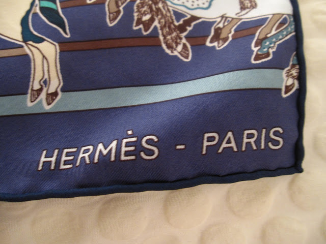 Close up of the Hermes logo on the Carre en Carres scarf