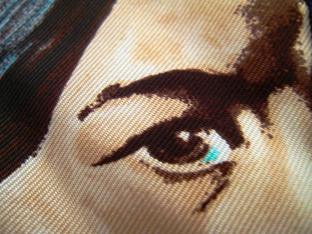 Close up of the detail on a native american man on the Hermes Carre en Carres scarf