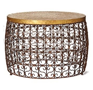 Iron drum coffee table with coils topped with an embossed brass top