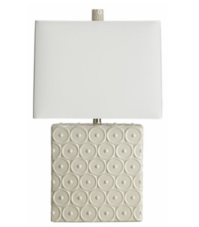 Rectangle porcelain table lamp with a raised graphic bulls eye pattern and a white glaze from Crate and Barrel