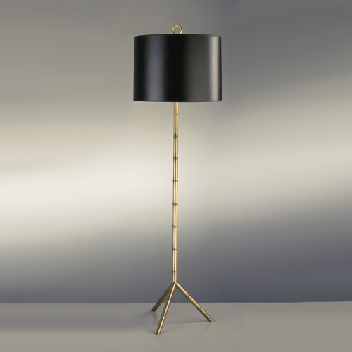 Metal floor lamp with bamboo detail and a tripod base and a black shade by Jonathan Adler from Croft & Little