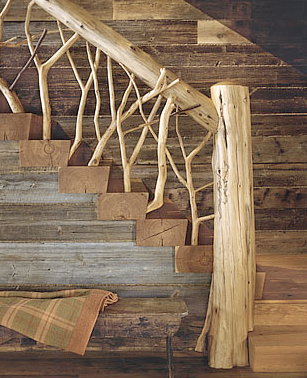 Detail of a main staircase railing made of tree branches and logs by Peter Pennoyer